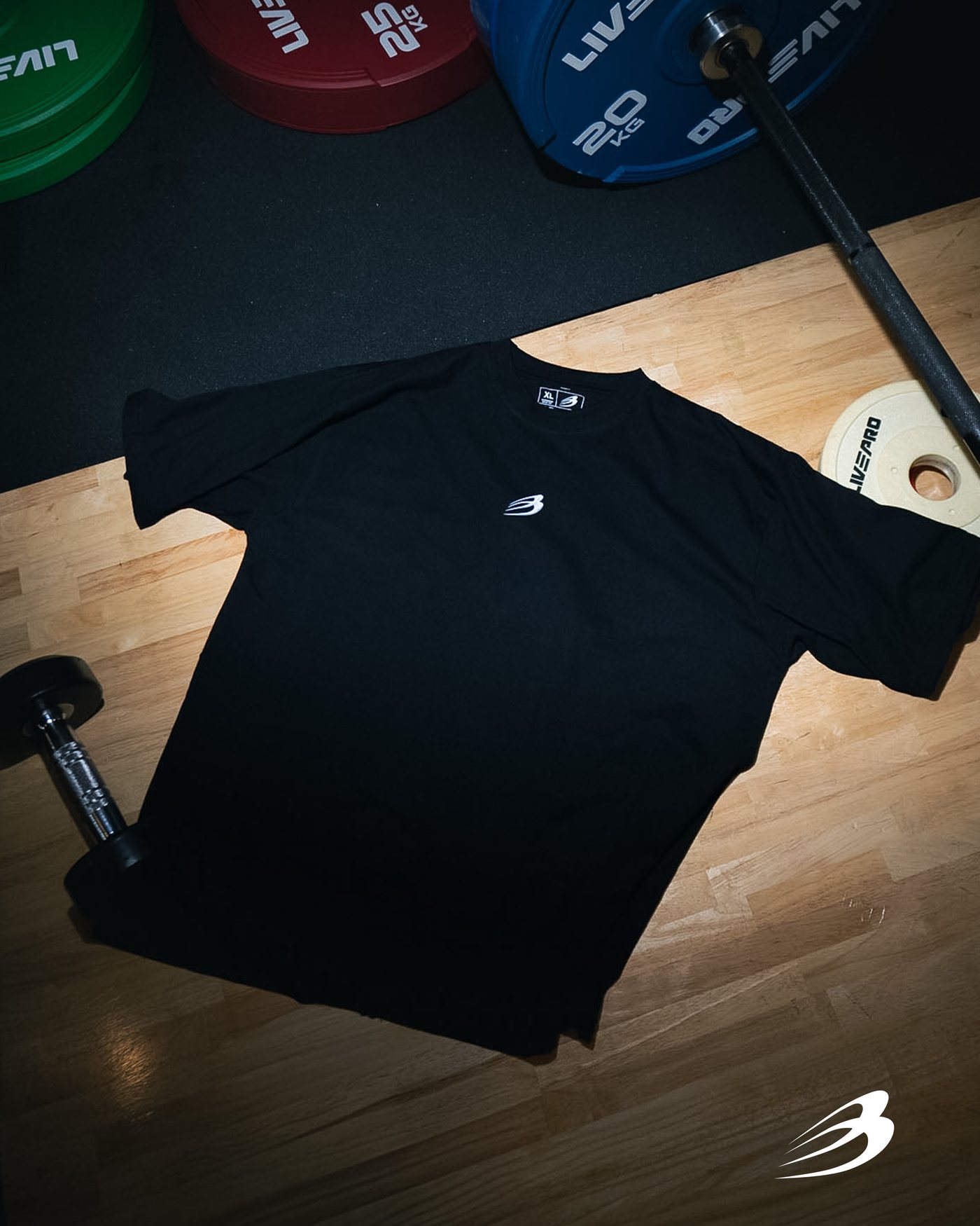 Black Iron tee folded next to plates