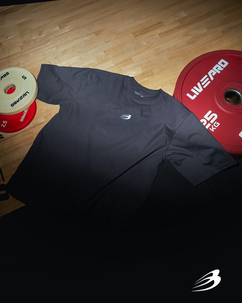 Lightning Storm tee folded next to plates