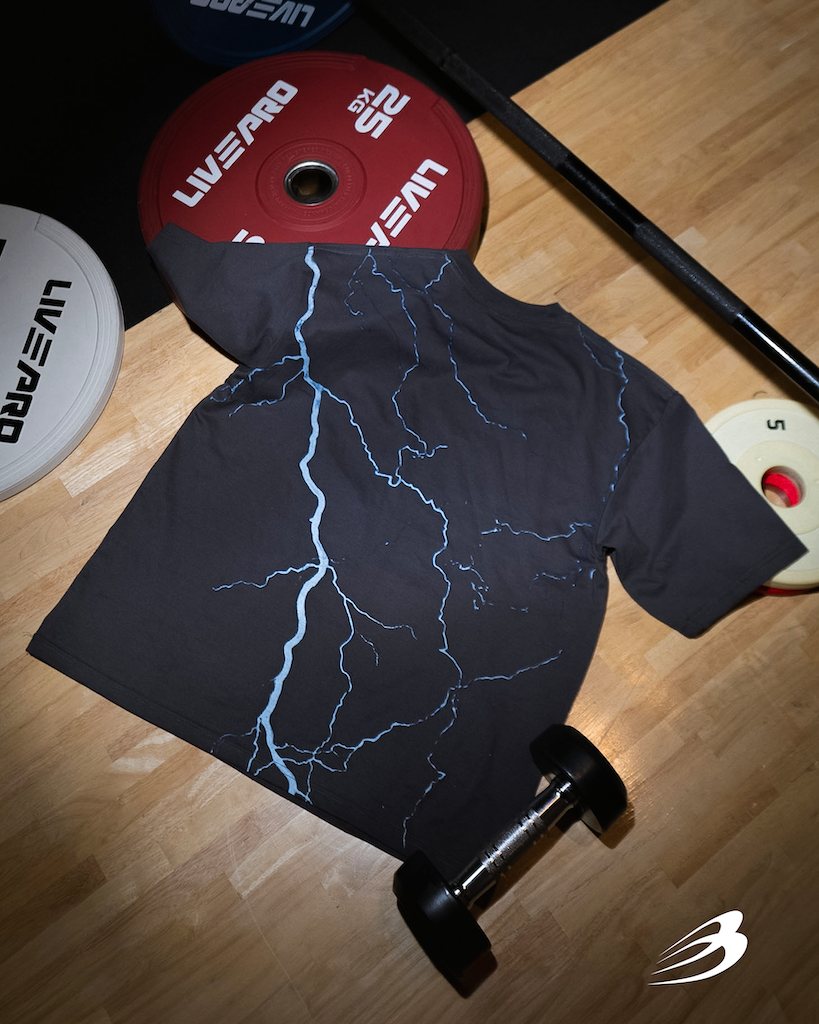 Lightning Storm tee on the gym floor, back print